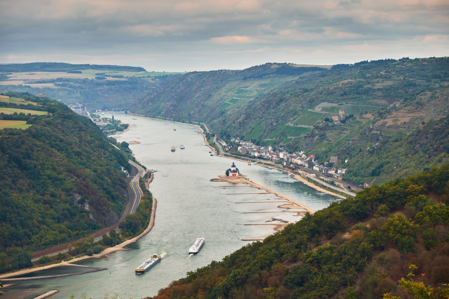 Aerial view to hills of Rheinland-Pfalz land and Hesse land with river Rhein and Kaub town from tourist route